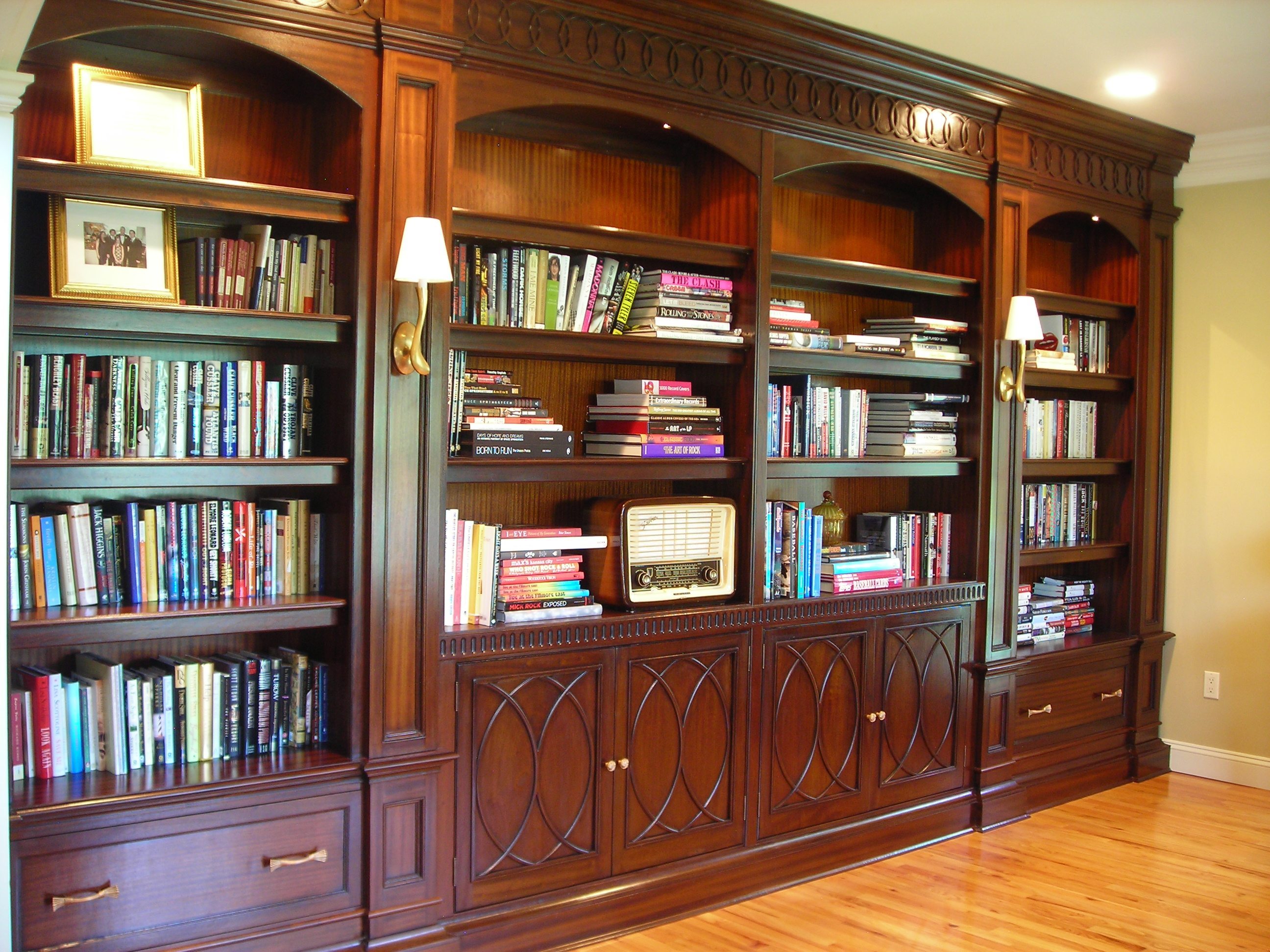Mahogany library cabinetry with carved mouldings - home offi.