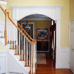 Fancy archway with wainscot in Foyer