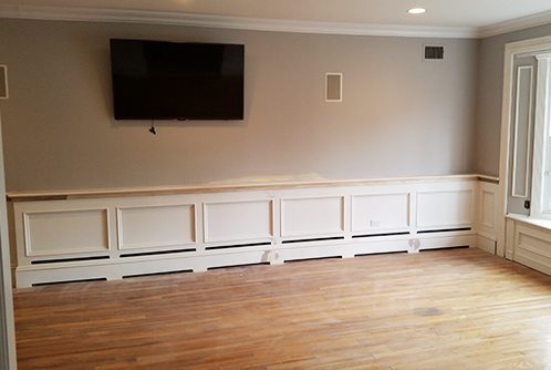 This is a long wall running 24', most of it has baseboard heat which will be concealed behind the wainscot panel, the heat will vent out the front of the panel.